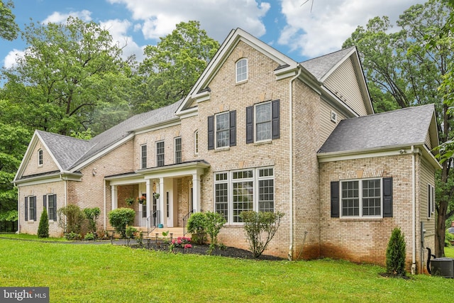 13330 Darnestown Rd, Darnestown, MD 20878 - georgian-style home with brick siding, central AC, a front lawn, and roof with shingles