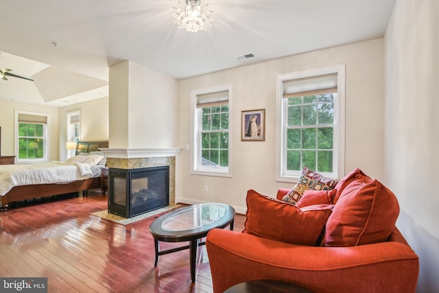 13330 Darnestown Rd, Darnestown, MD 20878 - bedroom featuring multiple windows, hardwood / wood-style floors, a tile fireplace, and baseboards