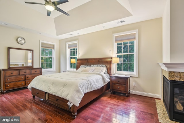 13330 Darnestown Rd, Darnestown, MD 20878 - bedroom featuring dark wood-type flooring, a raised ceiling, baseboards, and a high end fireplace