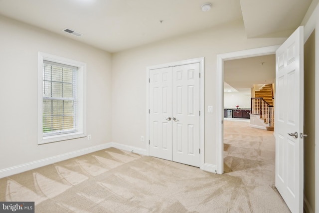 13330 Darnestown Rd, Darnestown, MD 20878 - unfurnished bedroom featuring light colored carpet, baseboards, and a closet