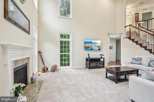 13330 Darnestown Rd, Darnestown, MD 20878 - living area with a high ceiling, stairway, a high end fireplace, carpet, and baseboards