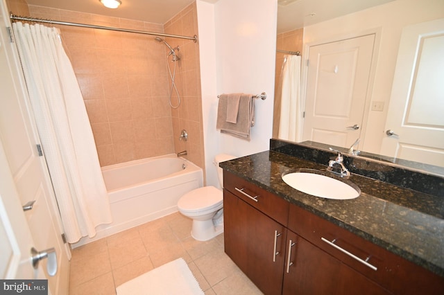 full bathroom featuring tile patterned flooring, vanity, toilet, and shower / tub combo