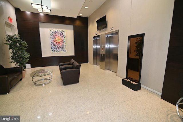 lobby featuring recessed lighting and a high ceiling