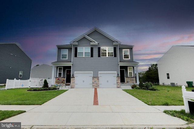 1214 Peterson Way, Absecon, NJ 08201 - craftsman-style home with a garage, driveway, and stone siding
