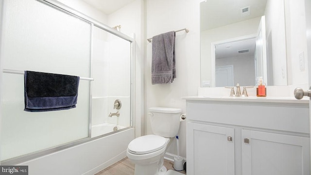 1214 Peterson Way, Absecon, NJ 08201 - full bath featuring vanity, toilet, enclosed tub / shower combo, wood finished floors, and baseboards