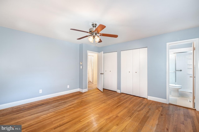 9005 Fieldchat Rd, Baltimore, MD 21236 - unfurnished bedroom with two closets, baseboards, light wood-type flooring, connected bathroom, and a ceiling fan
