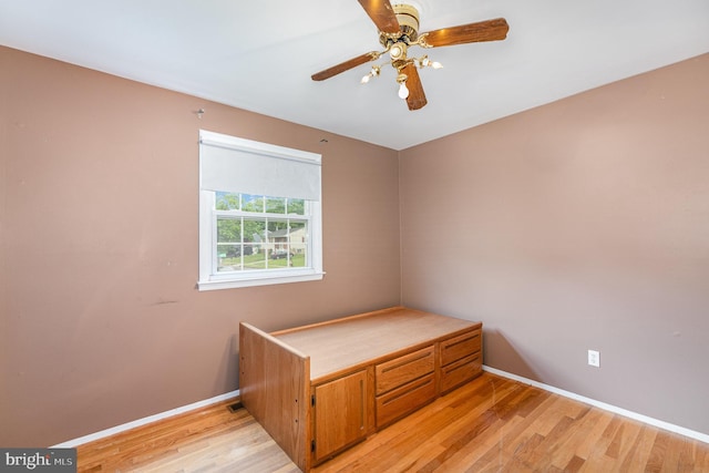 9005 Fieldchat Rd, Baltimore, MD 21236 - unfurnished bedroom featuring light wood-type flooring, baseboards, and ceiling fan