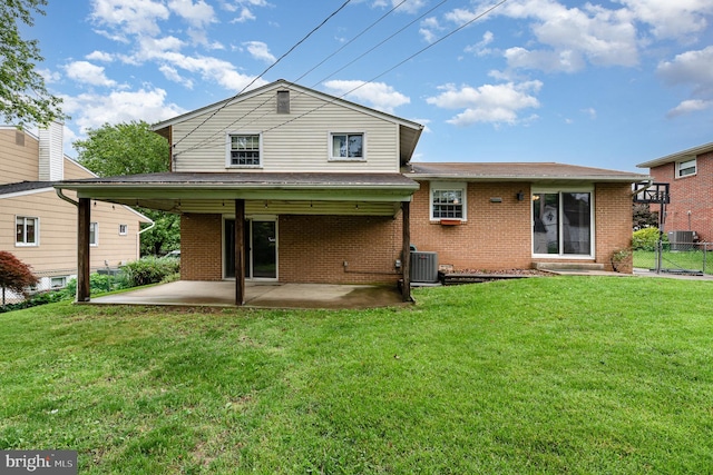 9005 Fieldchat Rd, Baltimore, MD 21236 - back of property with brick siding, a patio area, and central AC