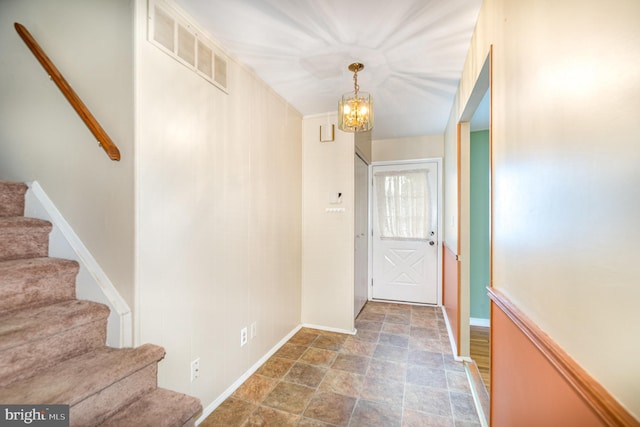 9005 Fieldchat Rd, Baltimore, MD 21236 - foyer with stone finish flooring, stairway, a chandelier, and baseboards