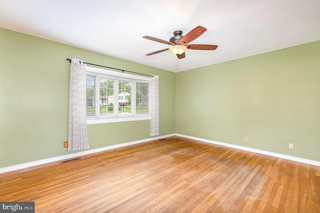9005 Fieldchat Rd, Baltimore, MD 21236 - spare room with wood finished floors, baseboards, and ceiling fan