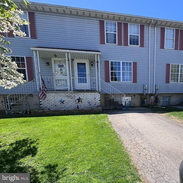 view of property with a front lawn