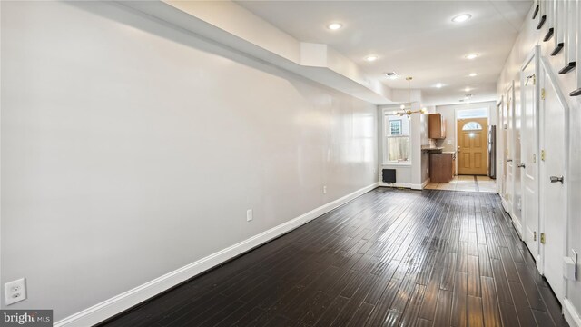 1321 W St SE, Washington, DC 20020 - hall with baseboards, a chandelier, dark wood-type flooring, and recessed lighting