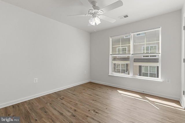 42189 Shorecrest Ter, Aldie, VA 20105 - spare room featuring wood finished floors, baseboards, and a ceiling fan