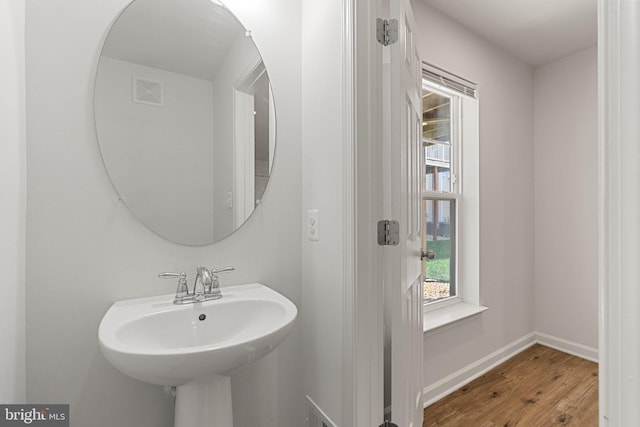 42189 Shorecrest Ter, Aldie, VA 20105 - bathroom with wood finished floors, baseboards, and a sink