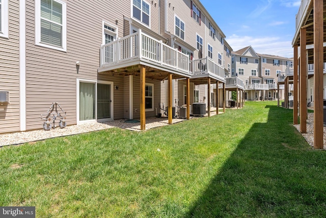 42189 Shorecrest Ter, Aldie, VA 20105 - view of green lawn with a wooden deck, central air condition unit, and a residential view