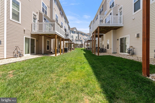 42189 Shorecrest Ter, Aldie, VA 20105 - view of grassy yard featuring central AC unit, a residential view, and a wooden deck
