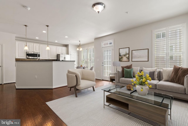 42189 Shorecrest Ter, Aldie, VA 20105 - living room with recessed lighting, dark wood-style flooring, and a chandelier