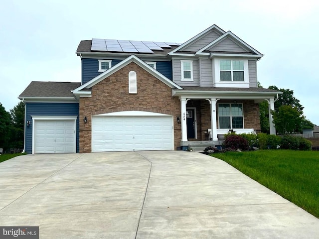 view of front of house featuring covered porch, stone siding, concrete driveway, and a garage