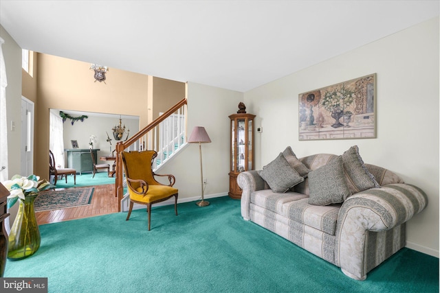 1418 Deer Meadow Ln, Garnet Valley, PA 19060 - carpeted living area featuring stairway, plenty of natural light, baseboards, and a chandelier