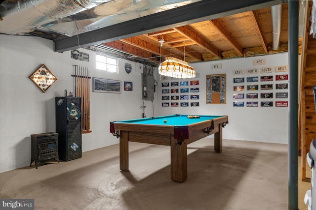 1418 Deer Meadow Ln, Garnet Valley, PA 19060 - recreation room featuring a wood stove, unfinished concrete floors, pool table, and electric panel