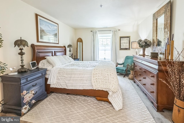 bedroom with wood finished floors