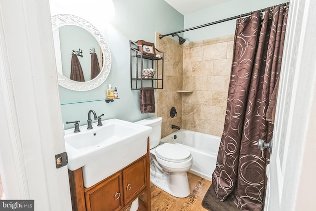 bathroom featuring shower / tub combo with curtain, vanity, and toilet