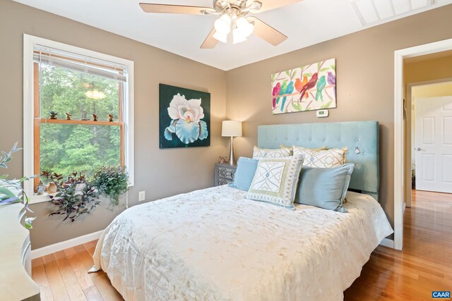 686 Snow Mountain Rd, Stanardsville, VA 22973 - bedroom with hardwood / wood-style flooring, baseboards, and ceiling fan