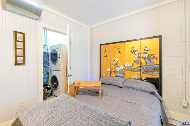 686 Snow Mountain Rd, Stanardsville, VA 22973 - bedroom with stacked washer and clothes dryer and ornamental molding