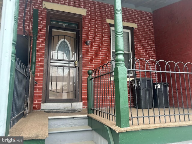 4415 Elizabeth St, Philadelphia, PA 19124 - doorway to property with brick siding and fence