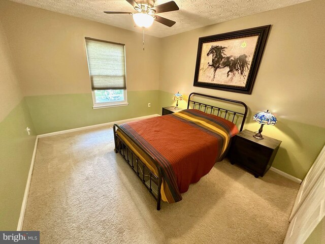18628 Winding Creek Pl, Germantown, MD 20874 - carpeted bedroom featuring a textured ceiling, baseboards, and ceiling fan