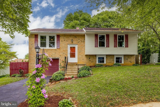 2103 Cameron Ct, Bel Air, MD 21015 - bi-level home with asphalt driveway, a garage, brick siding, and a chimney