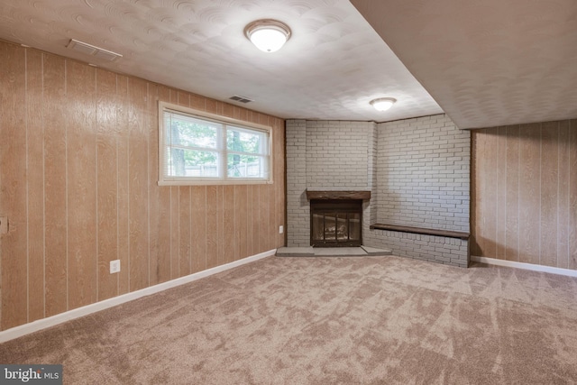 2103 Cameron Ct, Bel Air, MD 21015 - unfurnished living room with a fireplace, wooden walls, carpet flooring, and baseboards