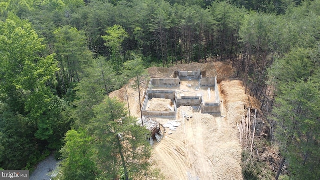 200 Wagon Trl, Berkeley Springs, WV 25411 - aerial view of property and surrounding area featuring a heavily wooded area