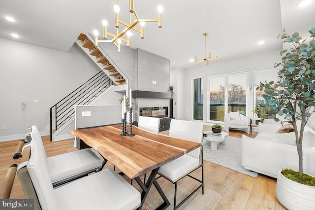 2201 E Somerset St Unit B3Upper, Philadelphia, PA 19134 - dining area with a chandelier, light wood-style floors, a fireplace, stairway, and recessed lighting