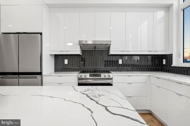 2201 E Somerset St Unit B3Lower, Philadelphia, PA 19134 - kitchen featuring appliances with stainless steel finishes, range hood, white cabinets, and modern cabinets