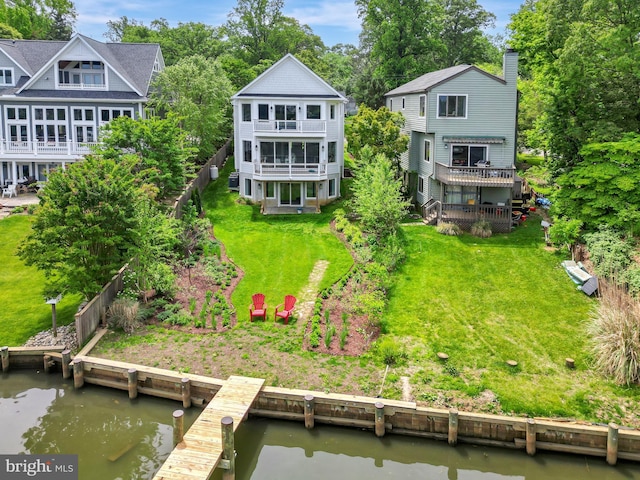 139 Spa Dr, Annapolis, MD 21403 - rear view of house with a chimney, a balcony, a lawn, and a deck with water view