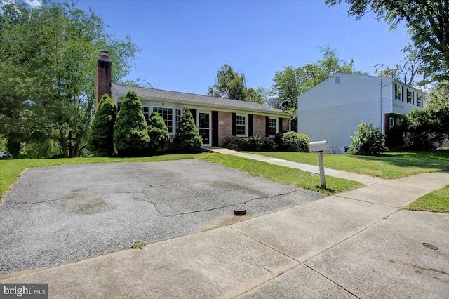 102 Andover Ct, Frederick, MD 21702 - ranch-style house featuring a front yard and a chimney