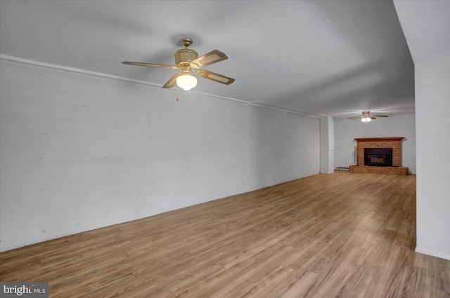 102 Andover Ct, Frederick, MD 21702 - unfurnished living room with ceiling fan, wood finished floors, and a fireplace