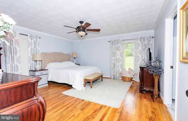 1765 Stone Dr, Huntingtown, MD 20639 - bedroom with wood finished floors, baseboards, ceiling fan, ornamental molding, and a textured ceiling