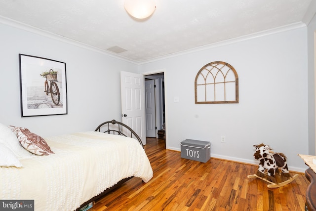 1765 Stone Dr, Huntingtown, MD 20639 - bedroom featuring ornamental molding, wood finished floors, and baseboards