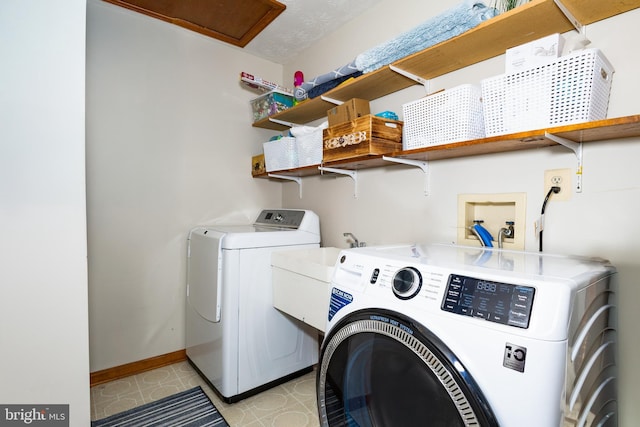 1765 Stone Dr, Huntingtown, MD 20639 - washroom featuring independent washer and dryer and baseboards