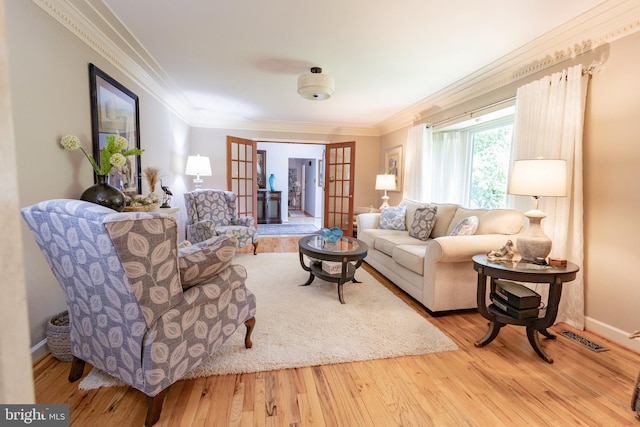 1765 Stone Dr, Huntingtown, MD 20639 - living area with french doors, ornamental molding, wood finished floors, and baseboards