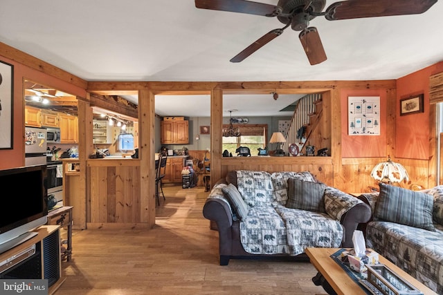 1939 Old Reading Rd Lot 67, 95, Catawissa, PA 17820 - living area with wood walls, a ceiling fan, and light wood-type flooring