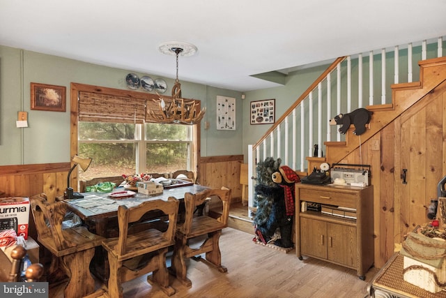 1939 Old Reading Rd Lot 67, 95, Catawissa, PA 17820 - dining room with a chandelier, stairs, light wood finished floors, a wainscoted wall, and wood walls