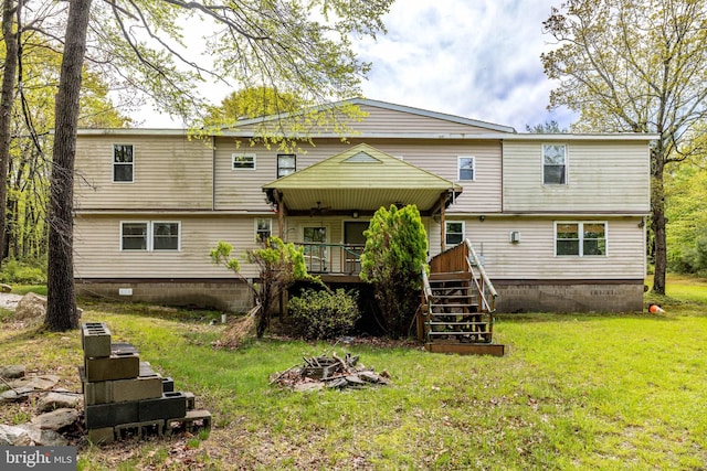 1939 Old Reading Rd Lot 67, 95, Catawissa, PA 17820 - rear view of property featuring stairs, a lawn, a fire pit, and a wooden deck