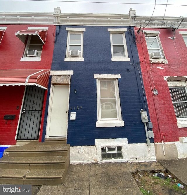 2137 W Toronto St, Philadelphia, PA 19132 - view of property featuring brick siding, entry steps, and cooling unit