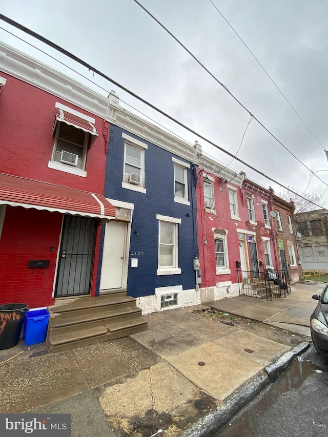 2137 W Toronto St, Philadelphia, PA 19132 - view of property featuring brick siding, entry steps, and cooling unit