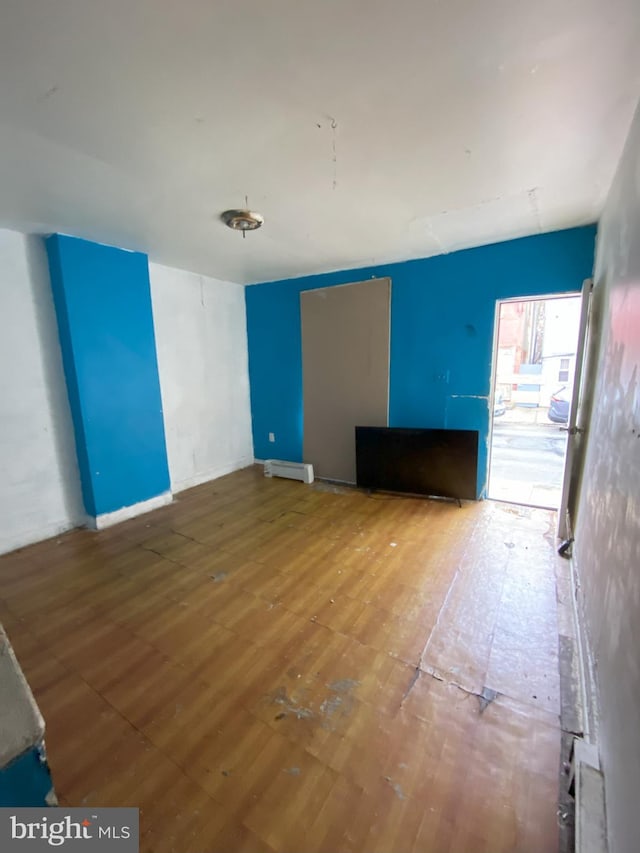 2137 W Toronto St, Philadelphia, PA 19132 - empty room with hardwood / wood-style flooring, a baseboard heating unit, and baseboards