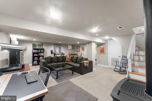 living area featuring recessed lighting, light colored carpet, stairs, and baseboards