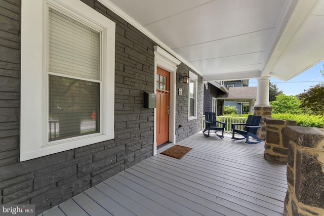 wooden deck featuring covered porch